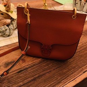 Like new Tory Burch crossbody. Dusty brick color